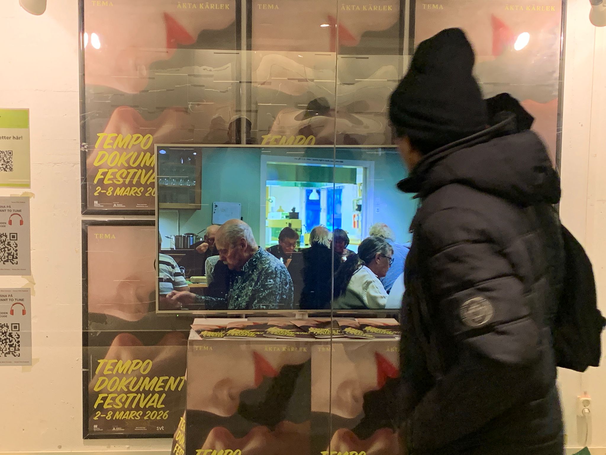 Passenger passing by public art installation 