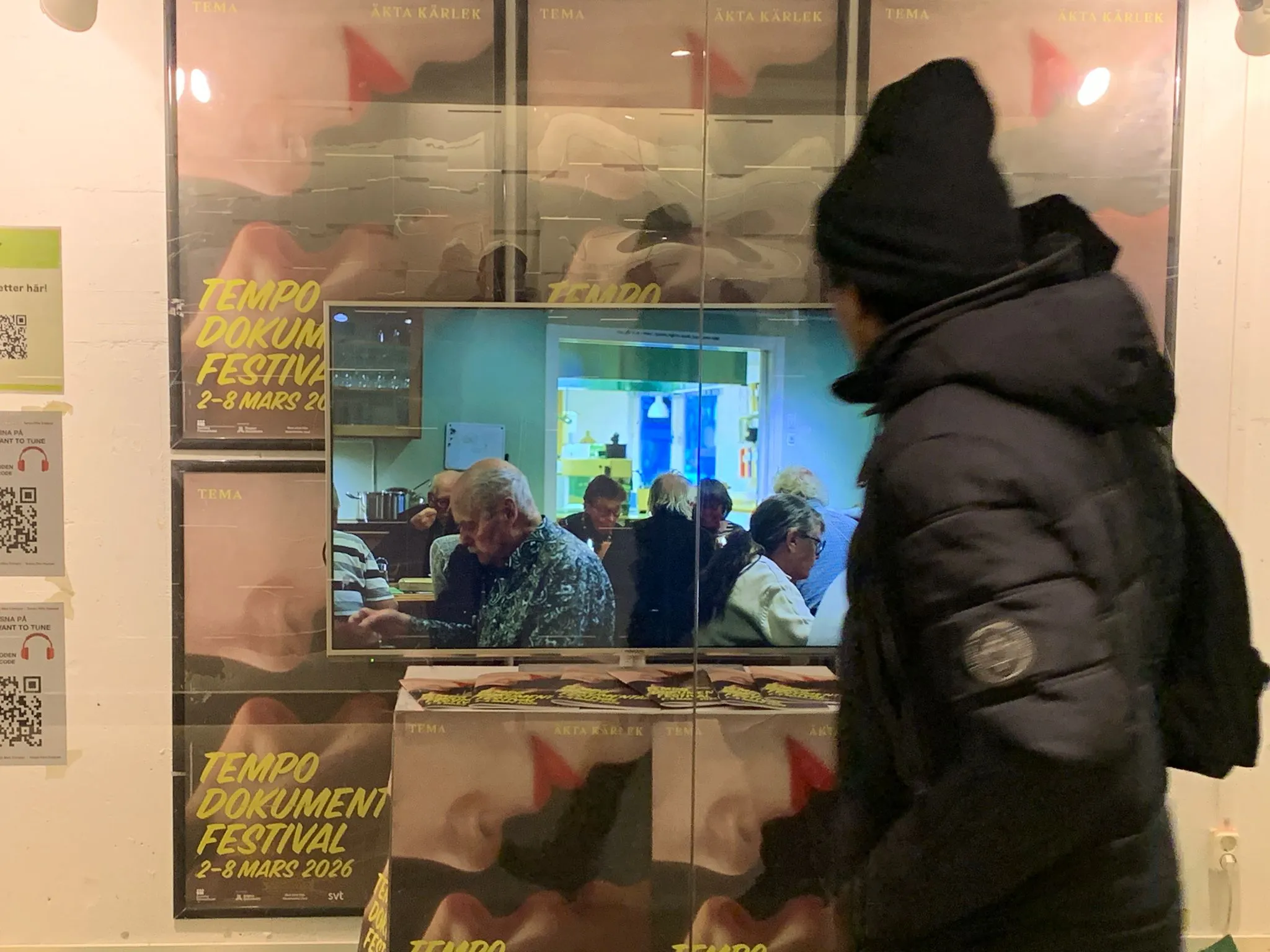 Passenger passing by public art installation 