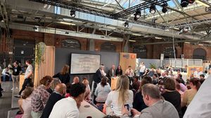 re/publica event with people listening to speakers