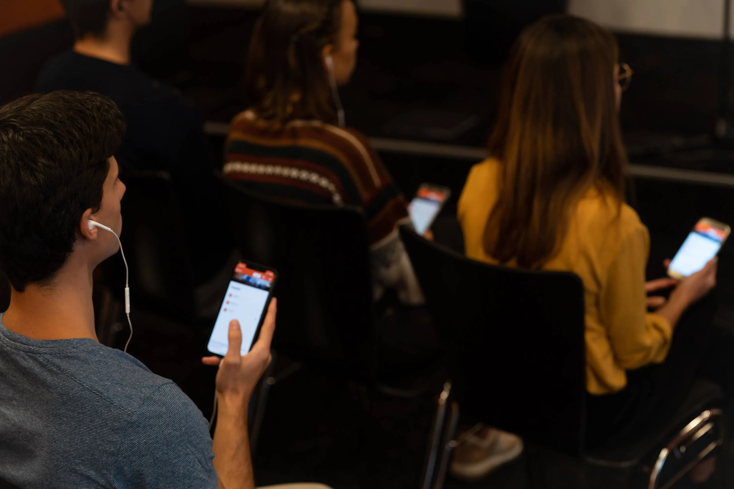 person listening at event via livevoice app