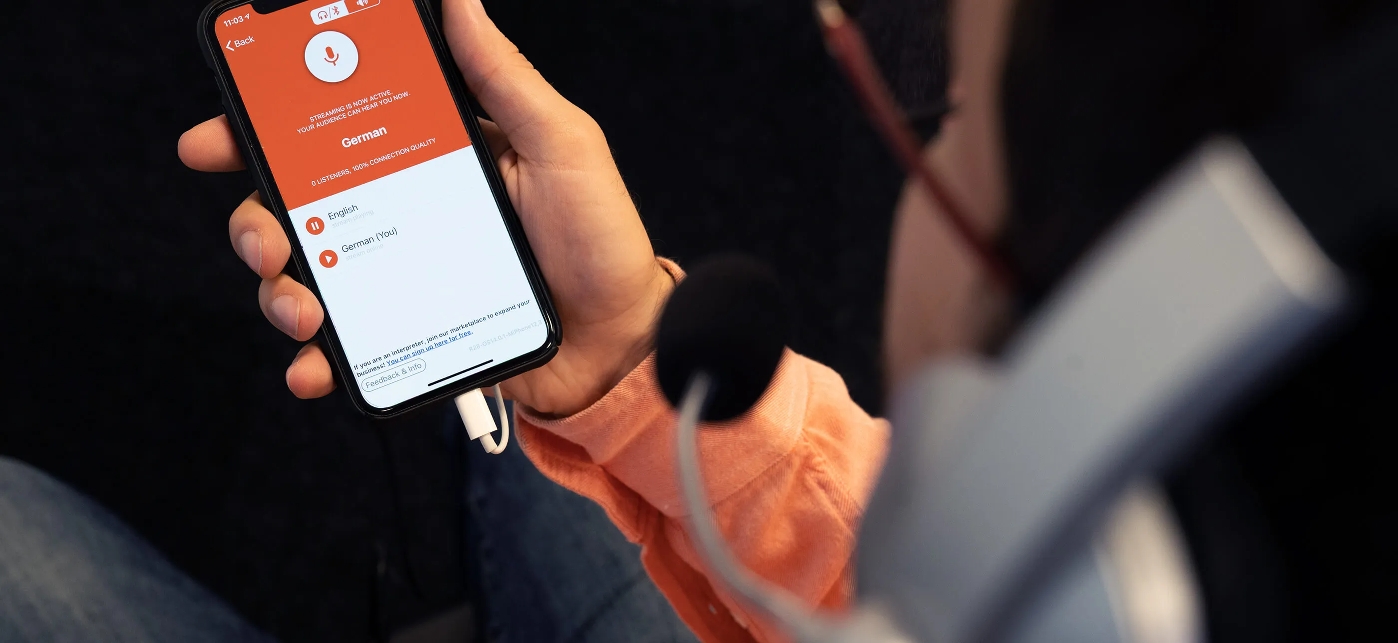 person listening at church via livevoice app
