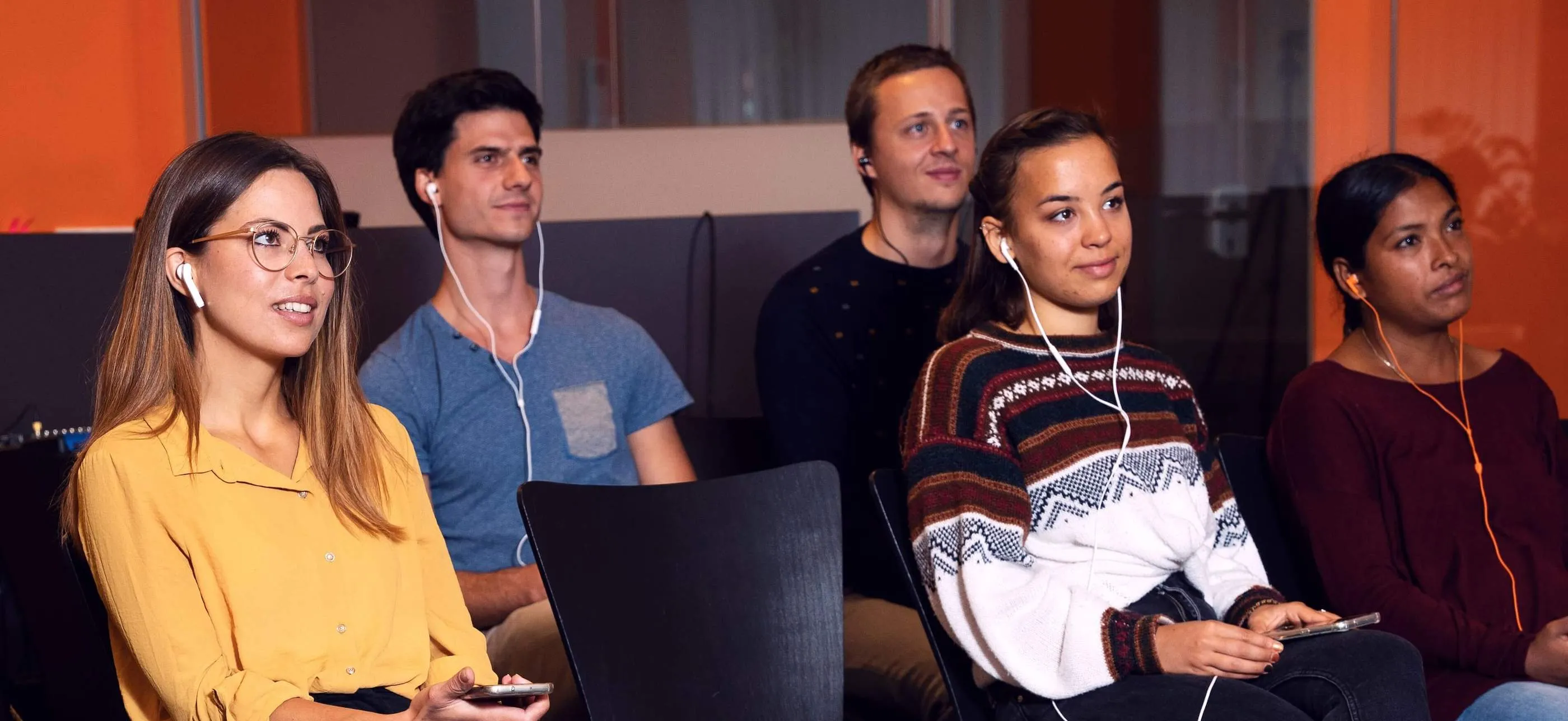 People listening at an event with Livevoice